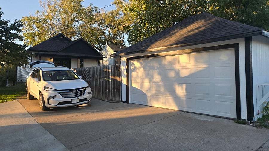 In the backyard, from the alley we have a garage space with remote control for one compact car and enough driveway to accommodate 2 extra cars
