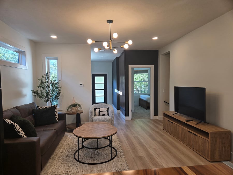 You will feel home in this living area, enjoying a good movie while connected to the kitchen and the beautiful and convenient island.