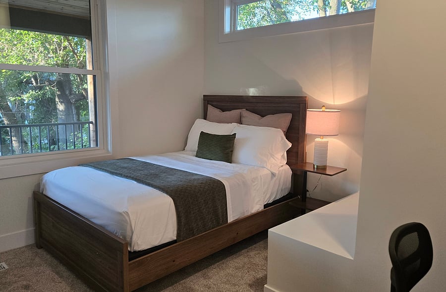 bedroom #1 with double (full) bed, closet, night stand, lamp with USB charger for your convenience, ceiling fan with remote control, desk and desk chair.