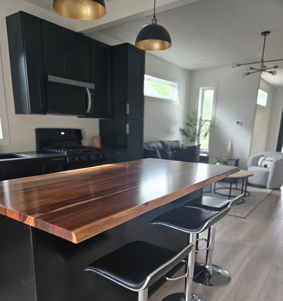 kitchen island with 4 bar stools with beautiful wood counter top