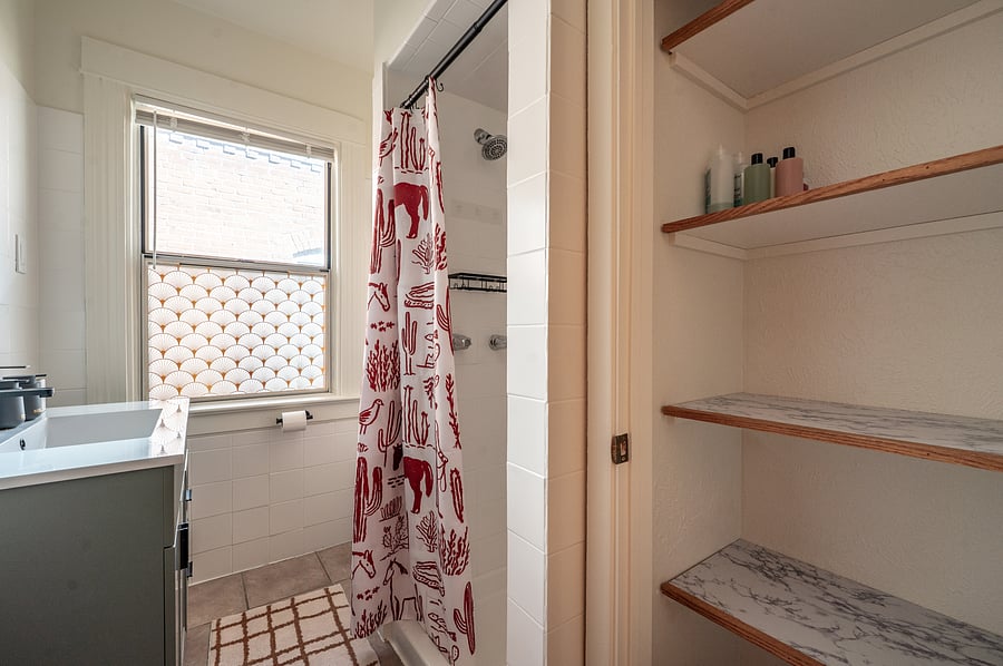 bathroom with linen closet in bathroom