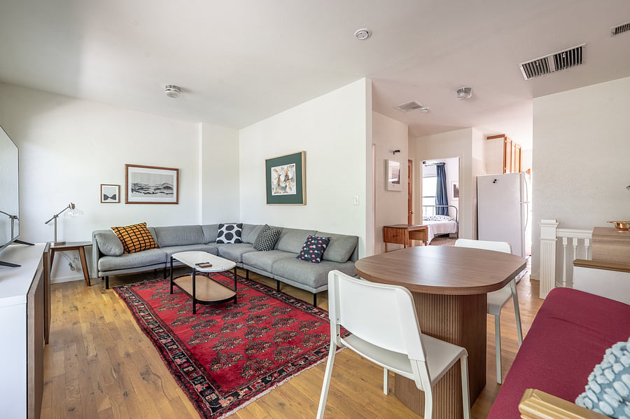 living room and dining area with church pew banquette
