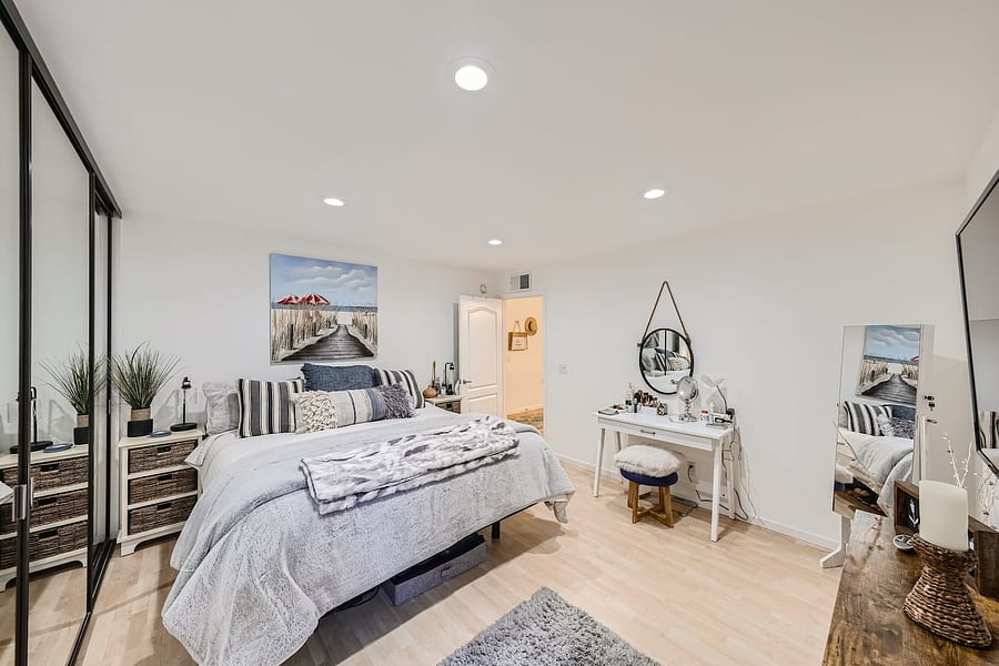 Plush bedding and layered pillows create a warm, inviting space for a restful stay.