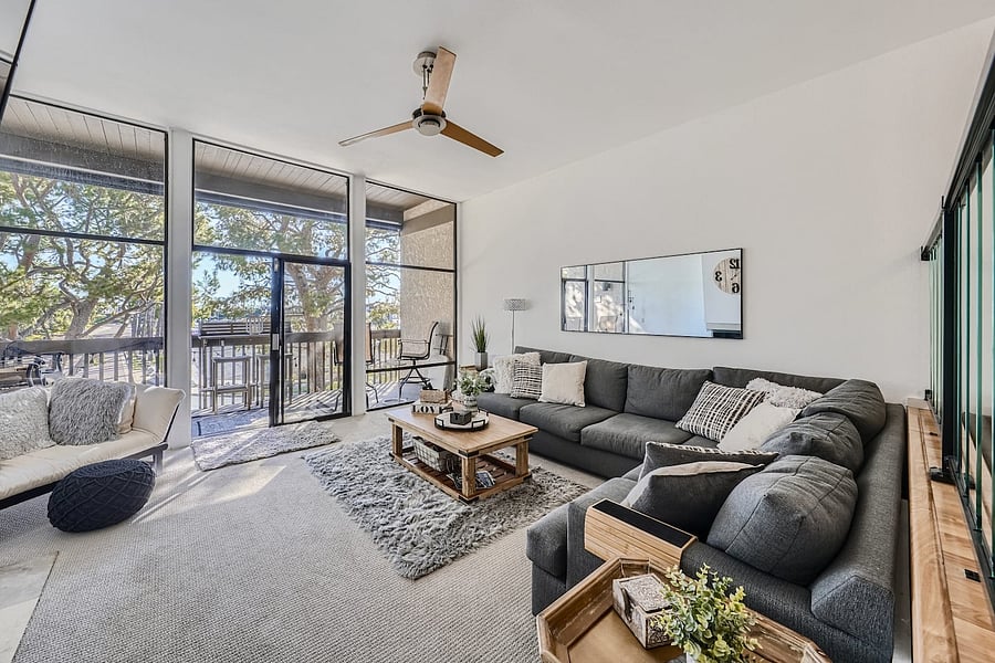 Guests can spread out between the main sectional, accent chairs, fireplace seating area, and dining space.