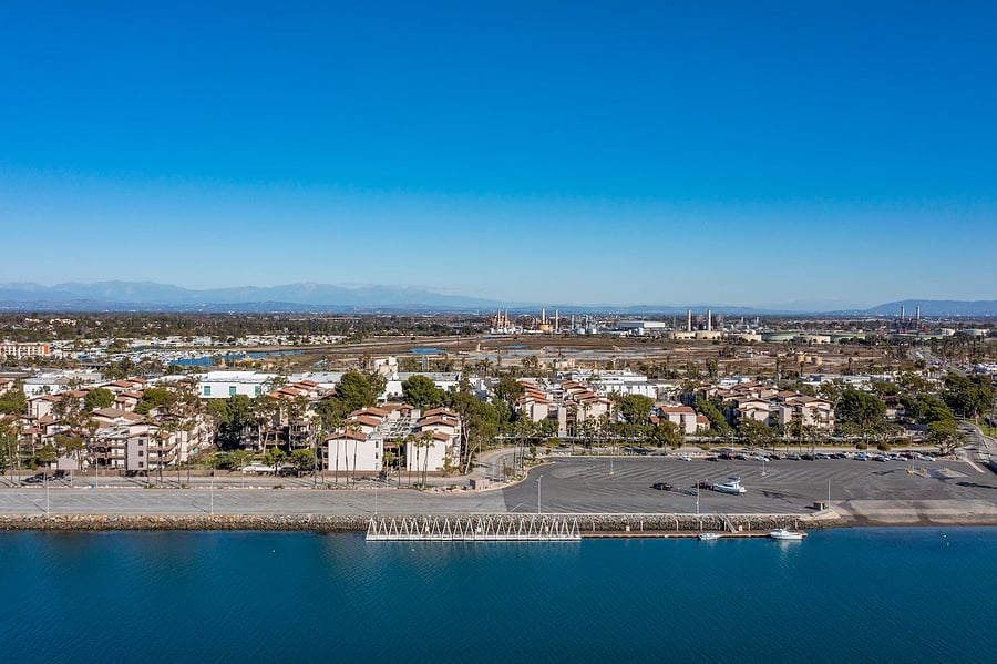 From the balcony, guests can enjoy views toward the surrounding neighborhood, mature trees, and nearby waterfront areas.