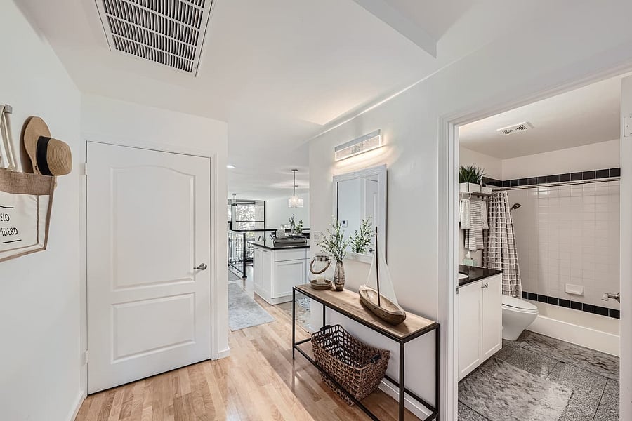 A dedicated desk or vanity area provides a convenient spot for getting ready or organizing personal items.