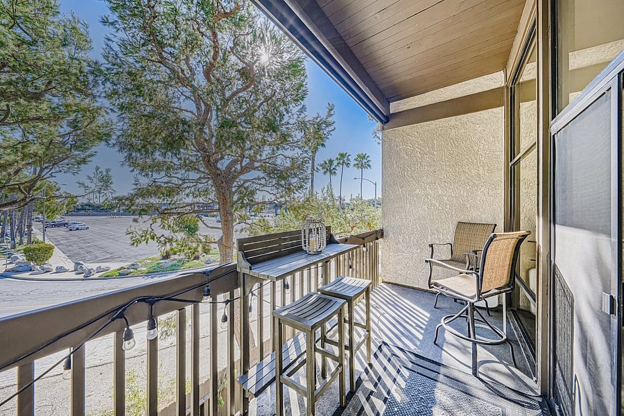 Enjoy fresh air from the private balcony, furnished with comfortable seating and a bar-height table-perfect for morning coffee or an evening drink.