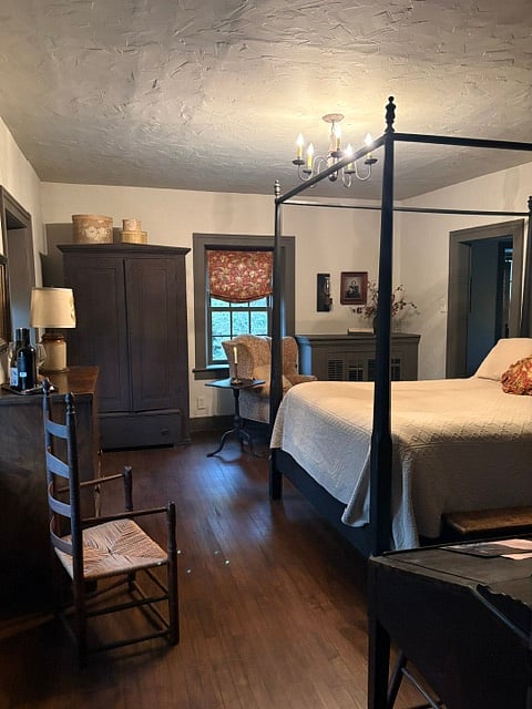 A comfy QN bed, antique wardrobe for your closet & antique blanket chest make this a comfy spot for a cup of tea & a good book