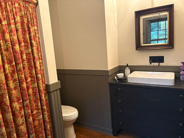 Big bathroom with a Kohler sink in an antique blanket chest & a 4' step in shower.