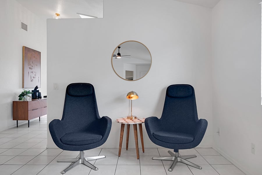 An inviting additional seating area that offers flexibility for relaxing, reading, or settling in during an extended stay.