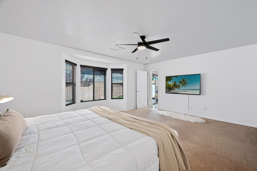 Another view of the comfortable king primary suite, designed to make both short visits and extended stays feel like home.