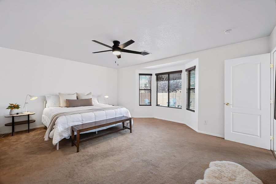 Spacious primary suite featuring a king-size bed, Roku Smart TV, and private ensuite bathroom for added comfort and privacy.