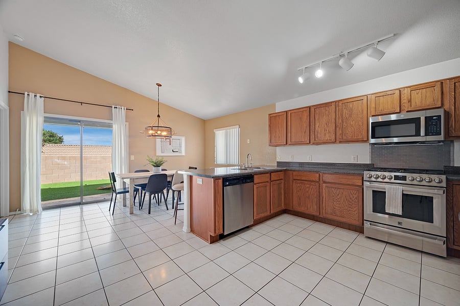 Fully equipped kitchen and adjoining dining space, thoughtfully furnished for everything from quick breakfasts to home-cooked family meals.