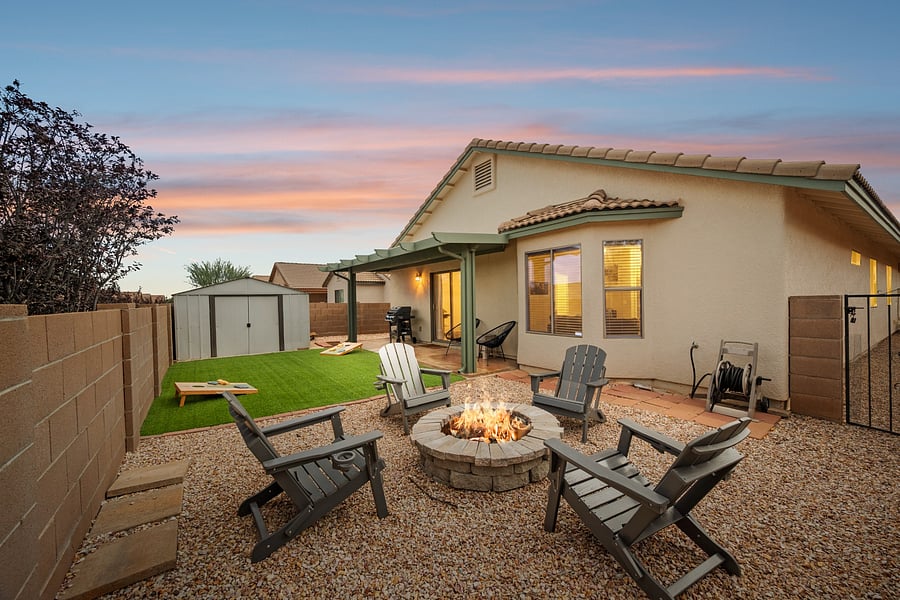 Unwind beneath the Arizona evening sky around the backyard fire pit, complete with Adirondack seating and a private fenced yard.