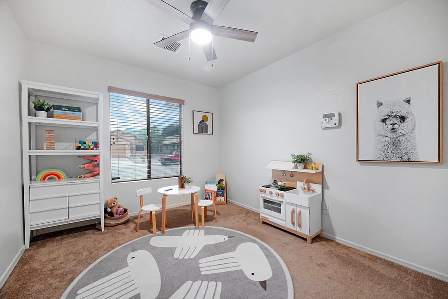 Dedicated children's playroom with toys, books, and games-a welcoming space for families traveling or relocating with little ones.