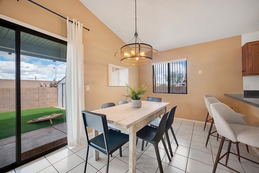 Welcoming dining area conveniently connected to the kitchen and backyard, making everyday meals and outdoor entertaining easy.