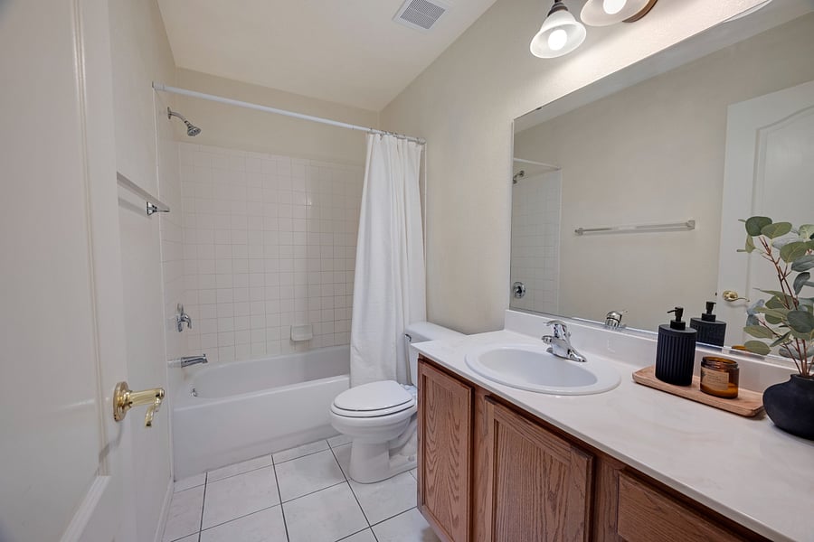 Second full bathroom conveniently serving the guest bedrooms and shared living spaces.