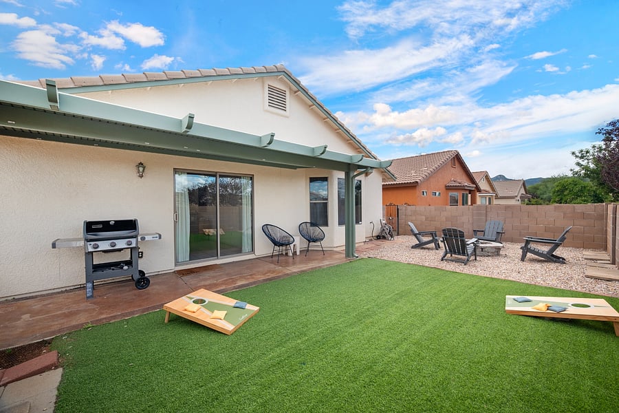Private, fully fenced backyard with lawn space, covered patio seating, and room to enjoy Sierra Vista's beautiful weather.