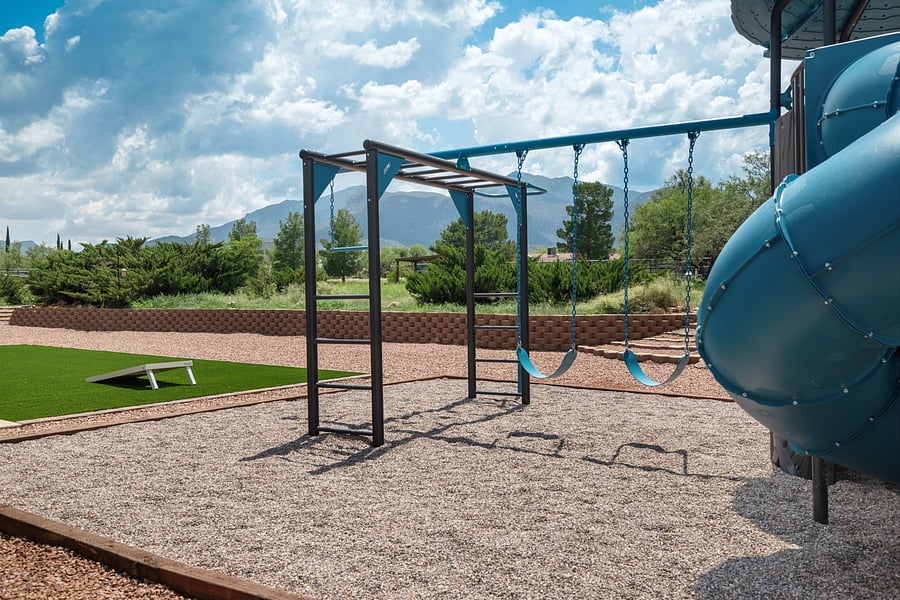 Backyard swing set with scenic mountain views, a fun outdoor feature for visiting families.