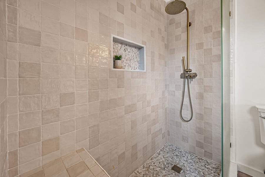 Attached primary bathroom with a walk-in shower for convenient daily routines.