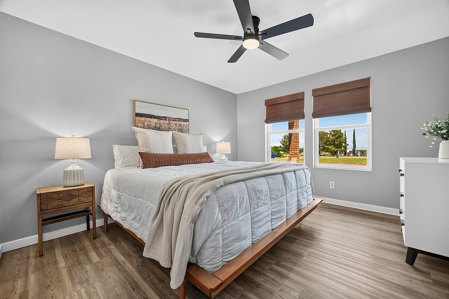 Bright, furnished second bedroom with natural light and a welcoming atmosphere.