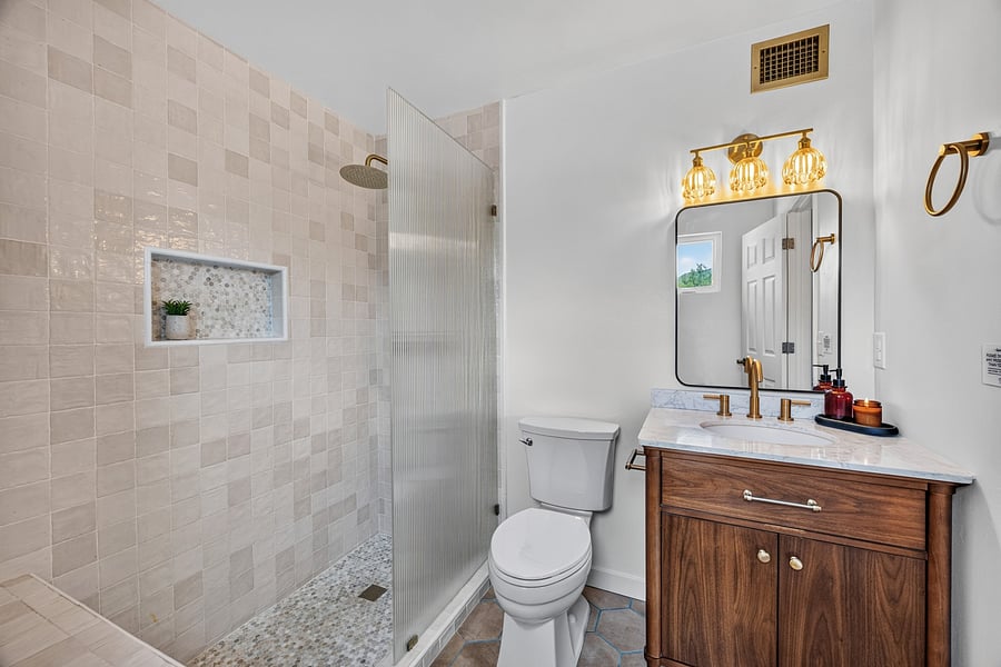 Attached primary bathroom with a walk-in shower for convenient daily routines.