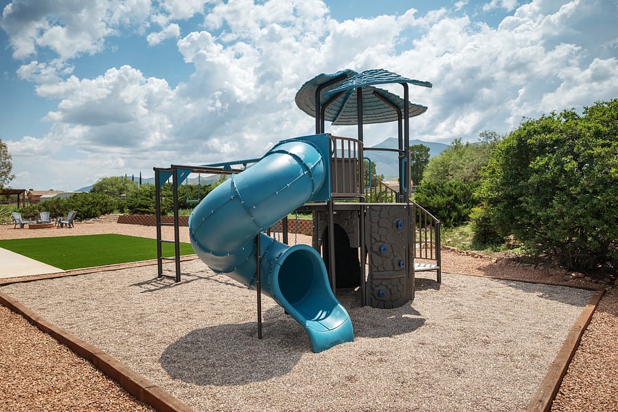 Private playground with a spiral slide and climbing features adds an extra option for family recreation.