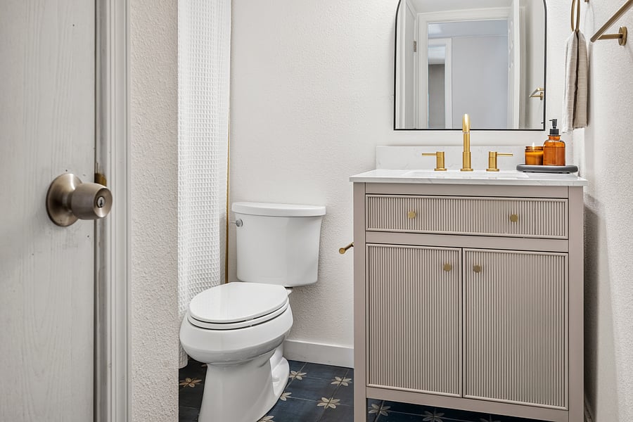 Guest bathroom includes a bathtub and shower for flexible everyday use.