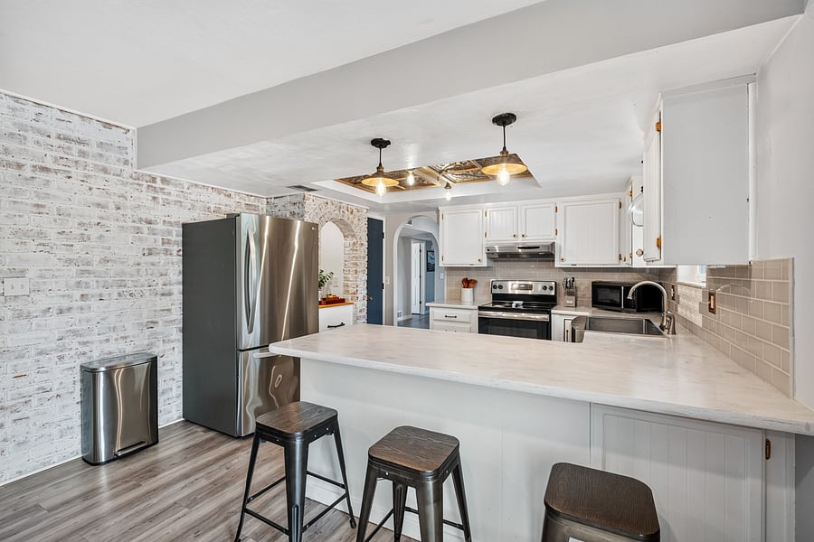 Open kitchen layout with a convenient breakfast bar for casual meals and morning coffee.