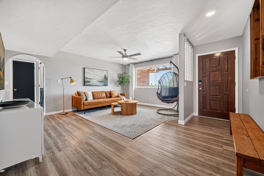 Bright, open living area with inviting furnishings and room to settle in during an extended stay.