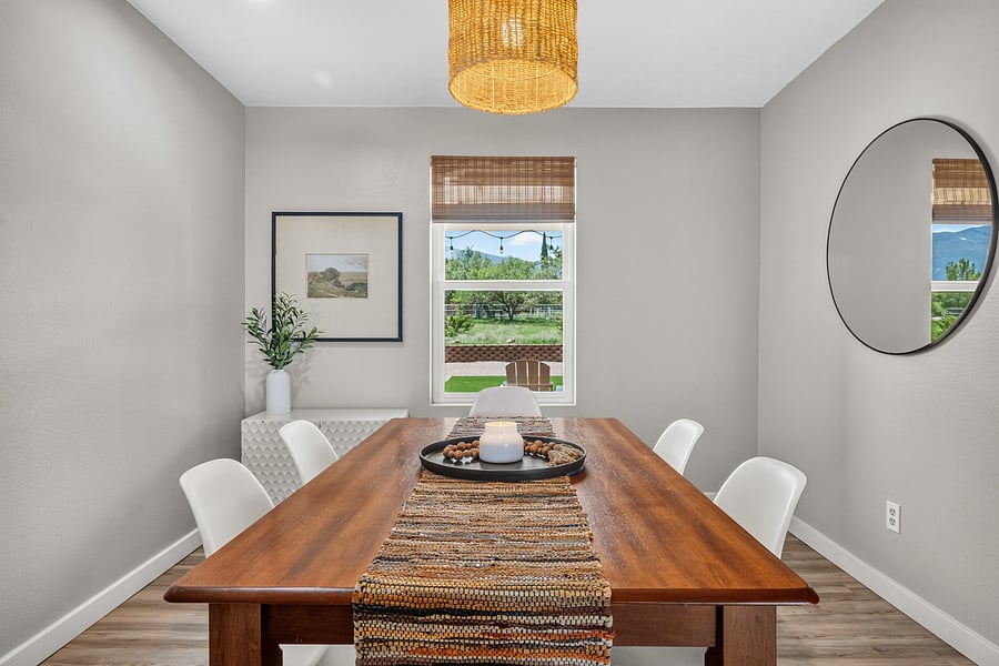 Welcoming dining area conveniently located beside the kitchen for easy meals at home.