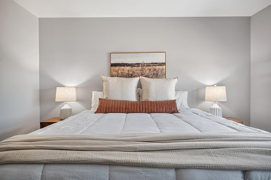 Second bedroom with a king-size bed, offering comfortable accommodations for additional adults or family.