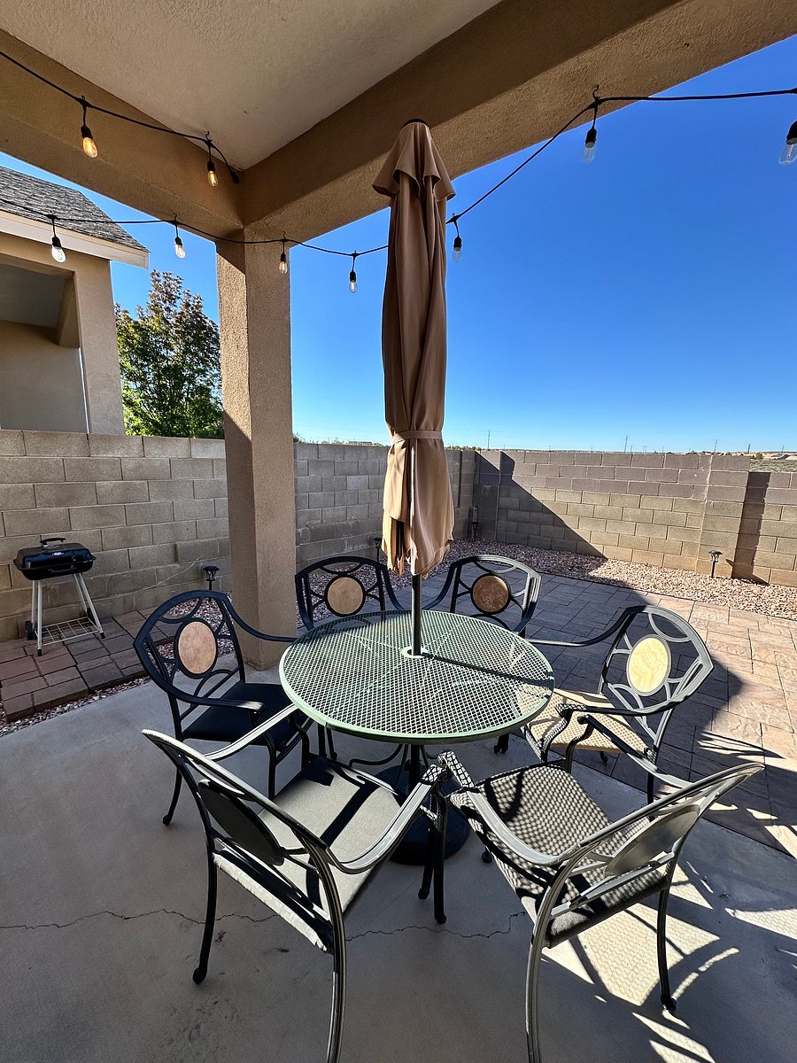 Backyard Tranquility
The outdoor table with 6 chairs is on the back patio. To the left side is a charcoal grill. Nice sky view and New Mexico sunsets are beautiful.