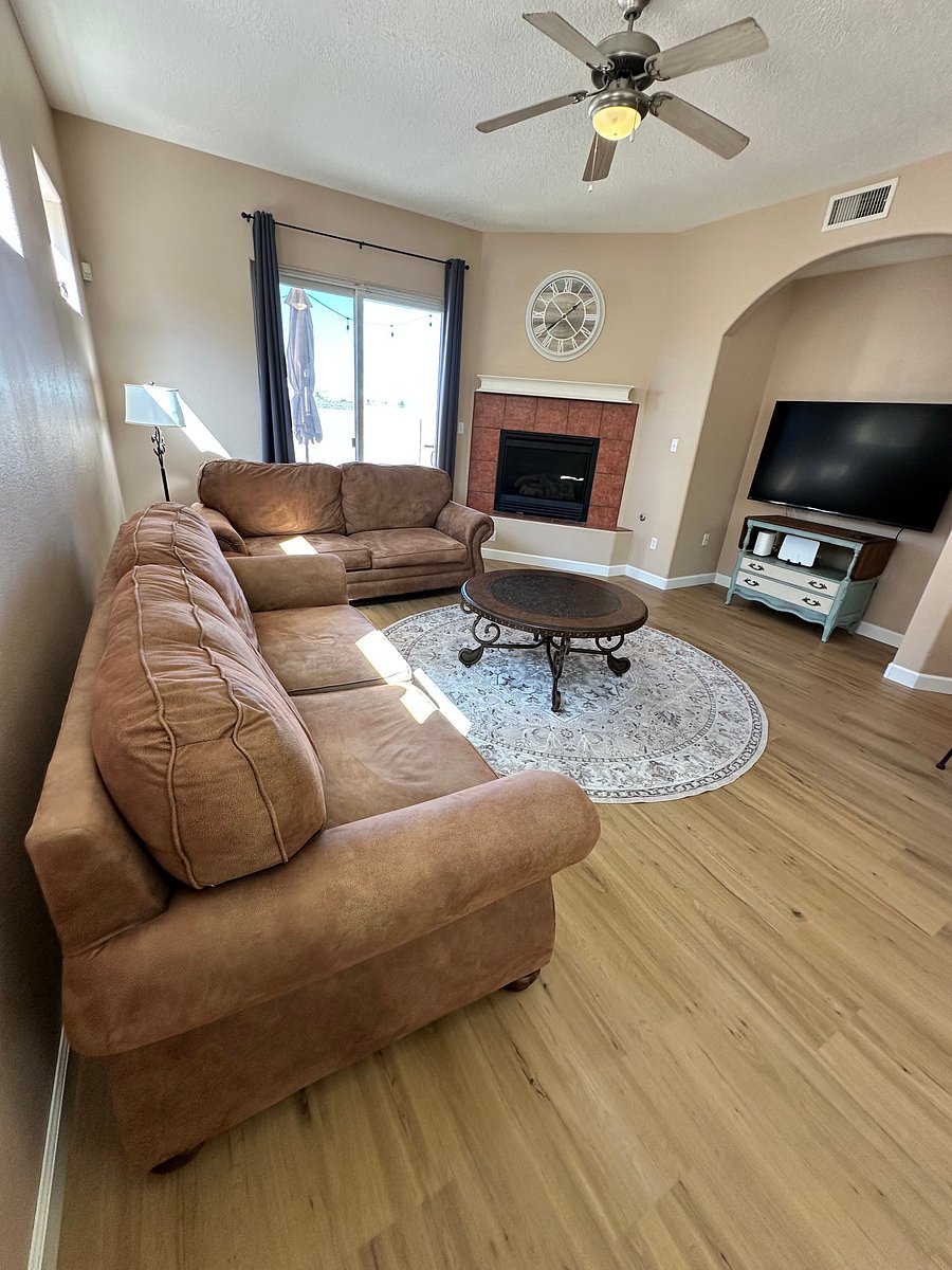 Entertainment room is in the back with the 64" tv and a fireplace. The sliding door leads to the backyard. Wifi is included in the utilities and an antenna for basic channels.