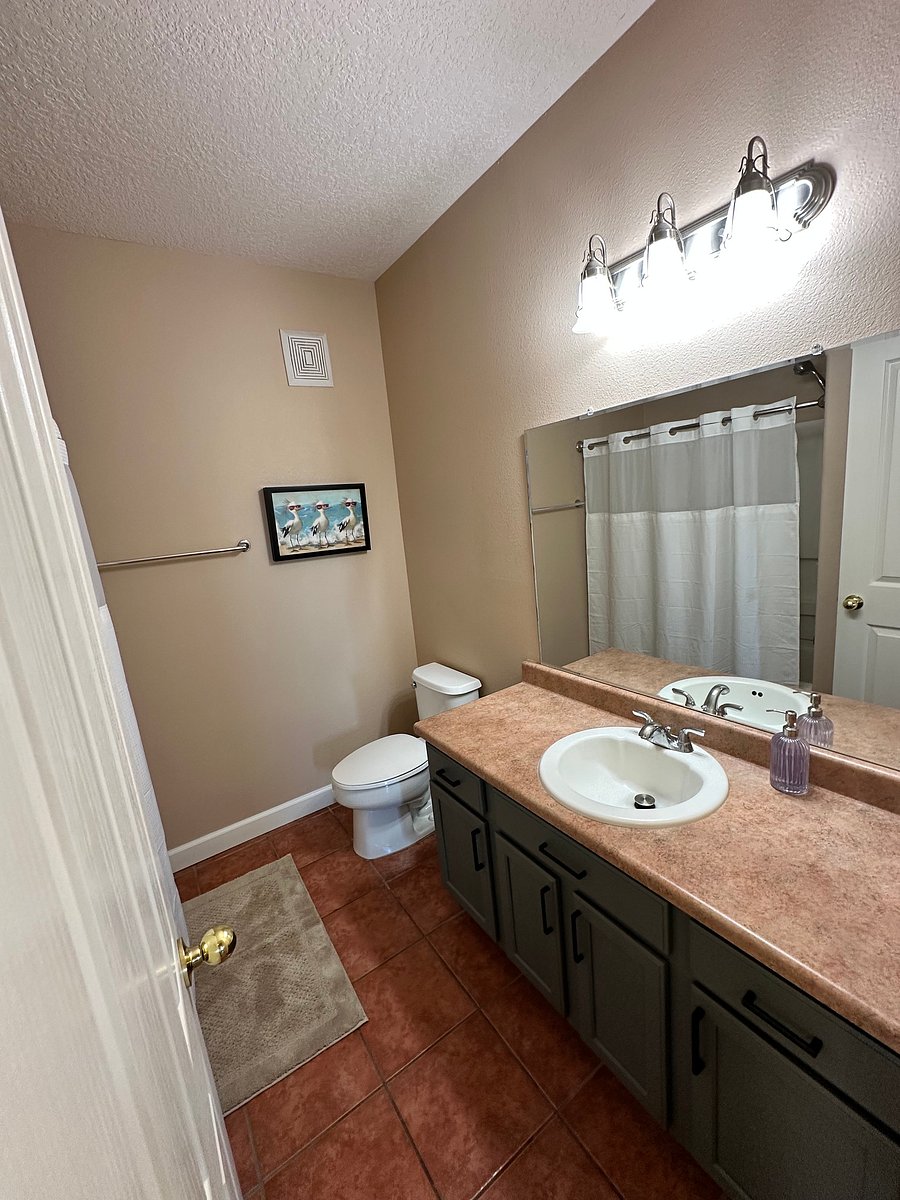 Private Bathroom for guest in Queensize bedroom.
In the mirror reflection is the curtain for the shower/bath combination.
