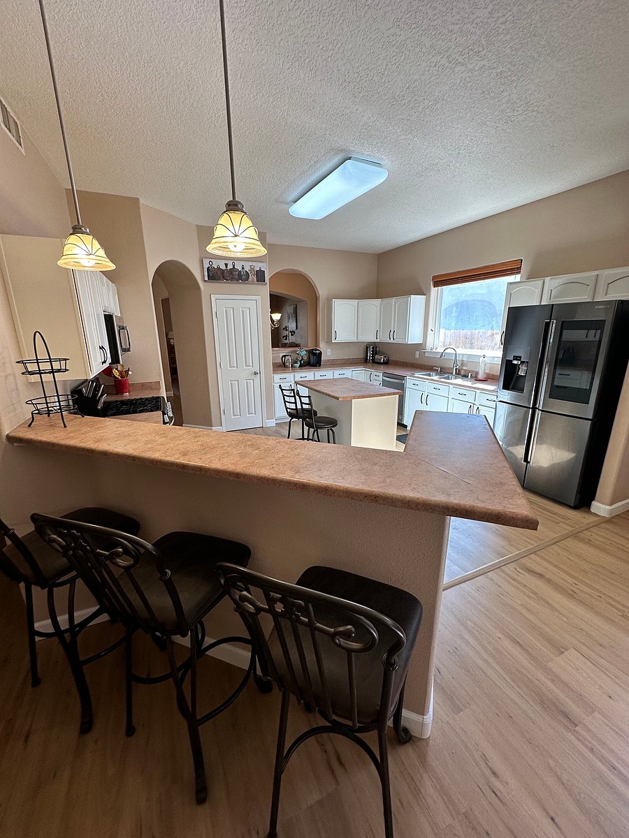 Added 3 tall bar stools for the higher bar and 2 stools at the kitchen island. Lots of space for laptops or eating.