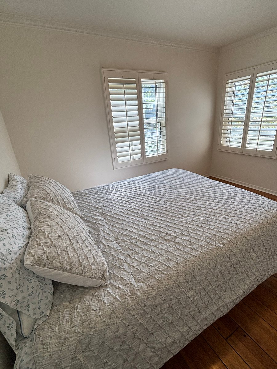 a queen bed, cloth closet, and a full bath room just outside this bedroom