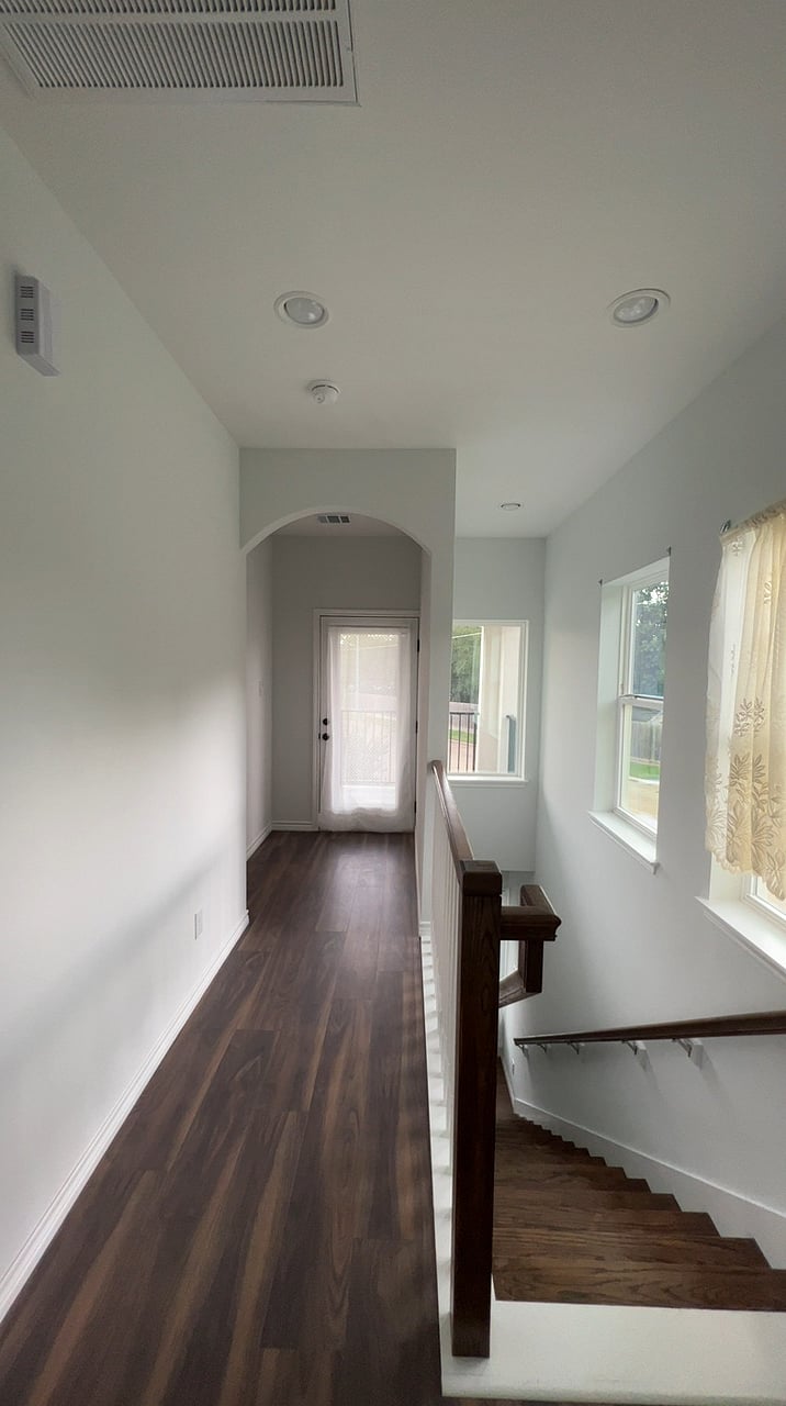 2nd floor hallway leading to Patio /Balcony overlooking park and front of property