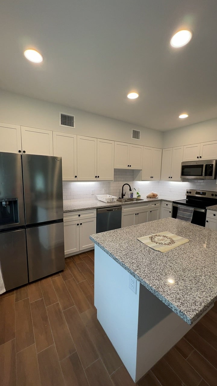 Kitchen overview - Refrigerator, Microwave, Dish washer, Electric range stove and available cabinets