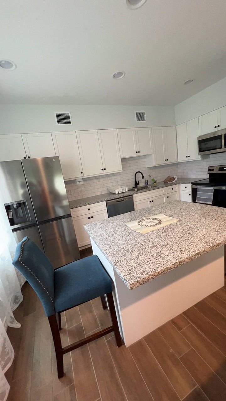 Kitchen overview - Refrigerator, Microwave, Dish washer, Electric range stove and available cabinets