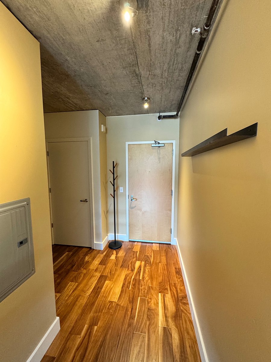 Front entrance coat rack. New flooring put in 2 years ago.
