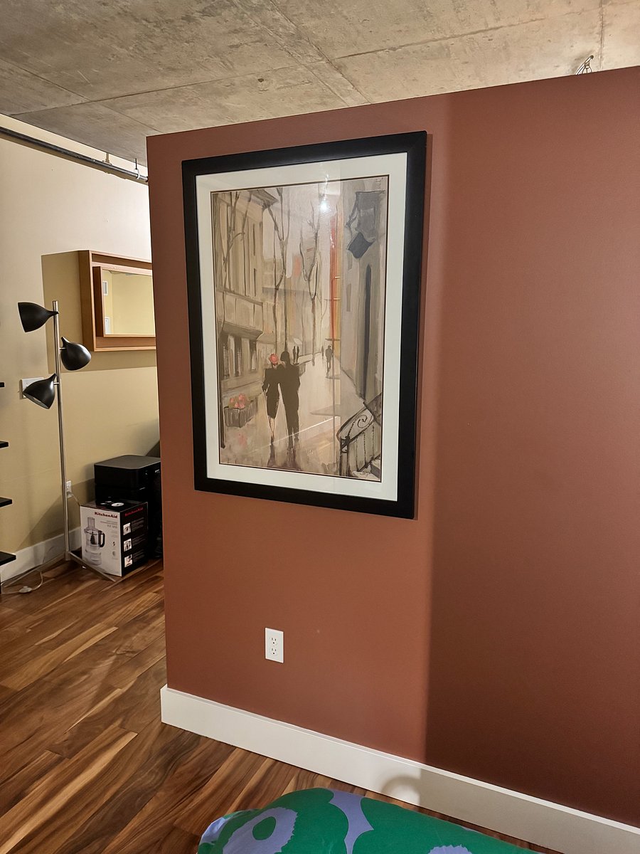 Art, plus large hallway mirror, tri-lighting and hallway storage/bookcase.