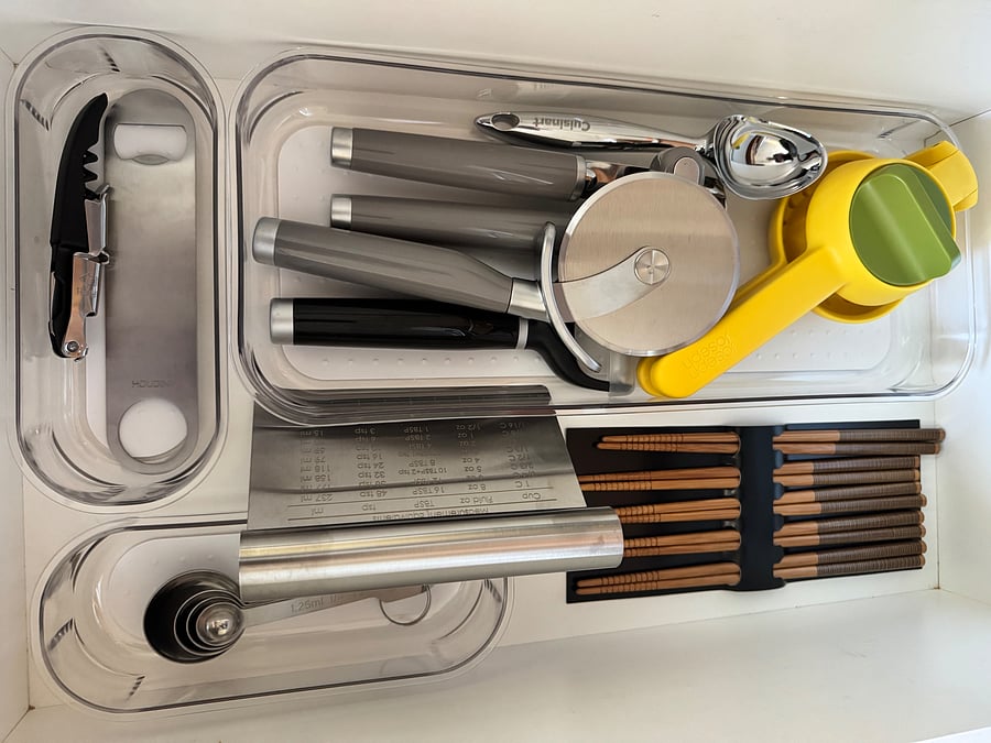 Utensils in kitchen drawers.