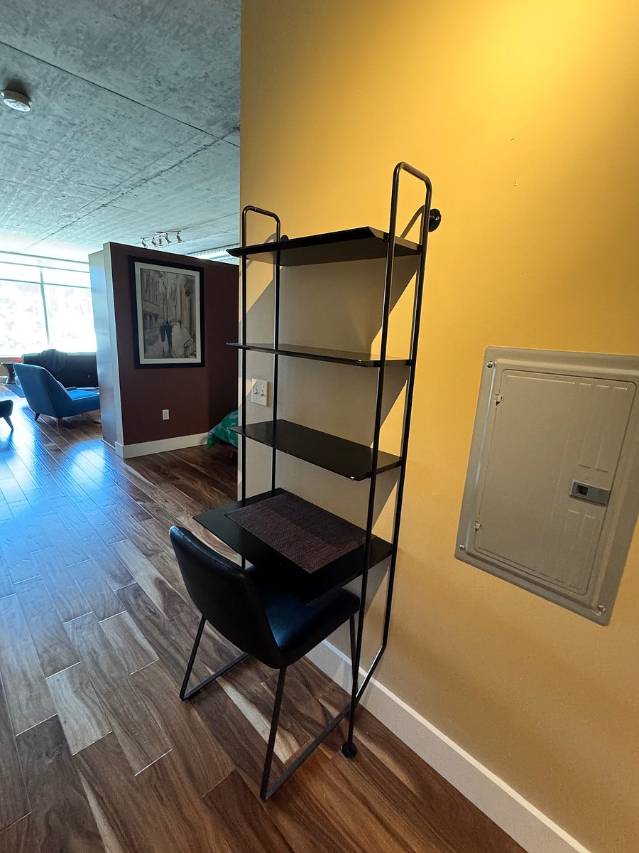 Entryway landing spot from Blu Dot (slightly and sadly scratched from its long trek from the Bay Area) with third kitchen chair for functionality.