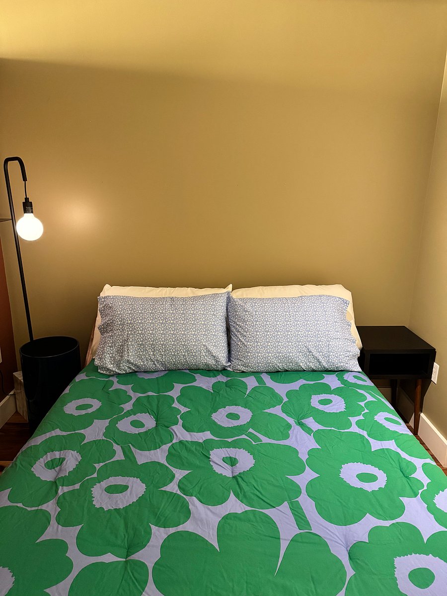 There is one firm and one soft pillow on each side of the bed.