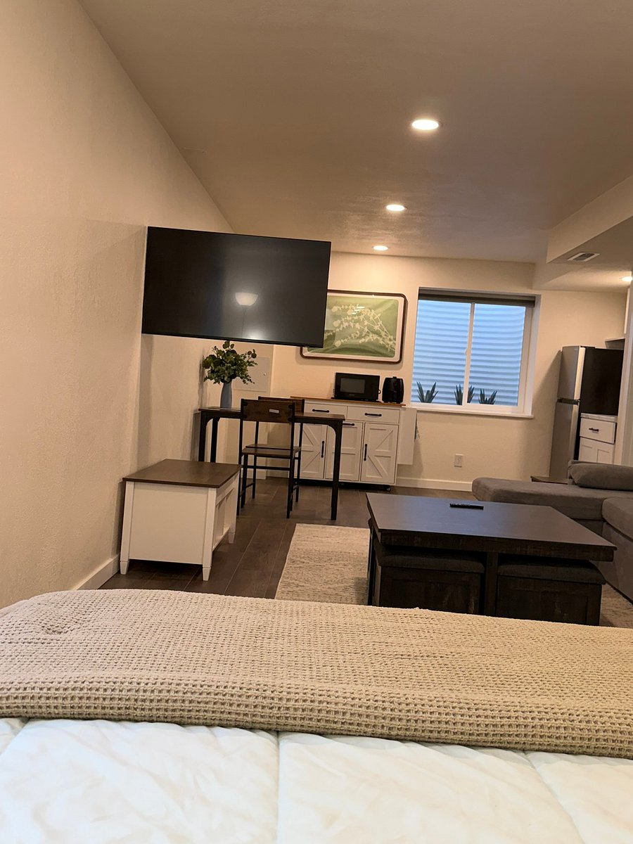 The TV pivots, so you can watch from the couch, your memory foam bed, or the dining table!