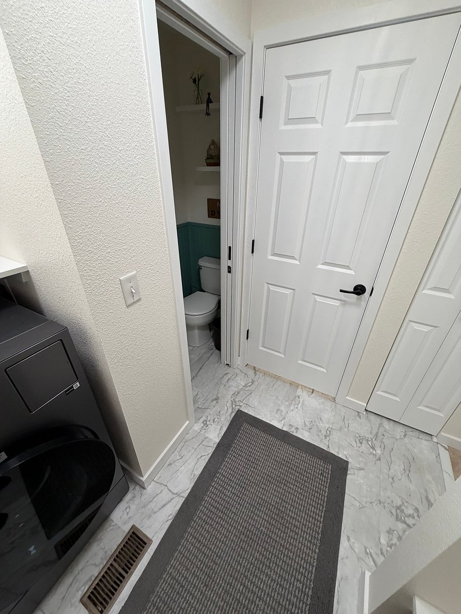 This is the mudroom you will enter to go down into your studio apartment. This area is a shared space but locked off from the rest of the house. You have your own laundry downstairs!