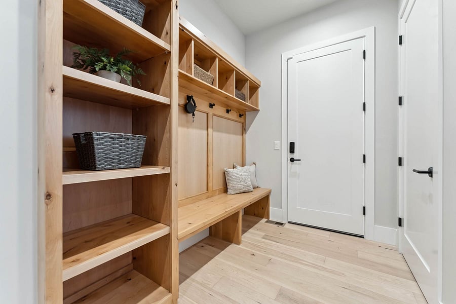 Mud room leading to double car garage. There'a an additional single car garage. Total of three cars.