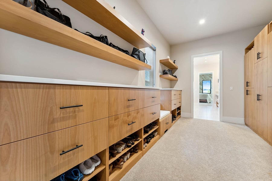 Primary closet. This has hardwood floors vs carpet as shown.