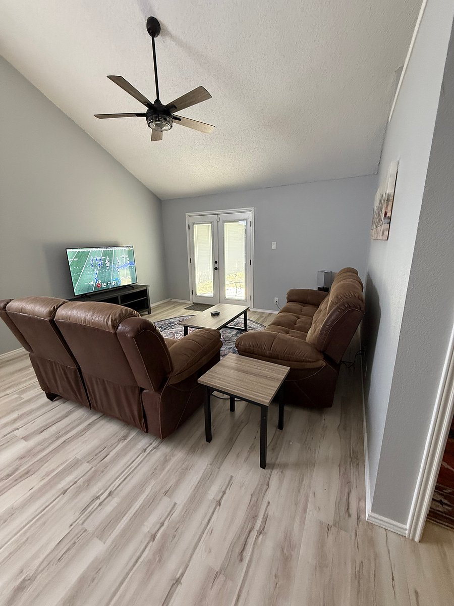 Living room with reclining sofa and loveseat